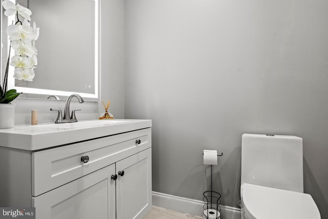 bathroom with vanity and toilet