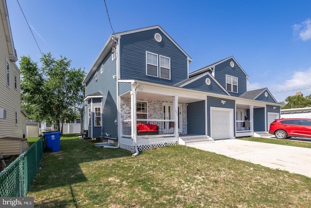 view of front of property featuring a garage, covered porch, and a front lawn