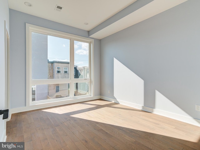 unfurnished room featuring light wood-type flooring