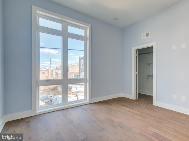 spare room featuring light wood-type flooring