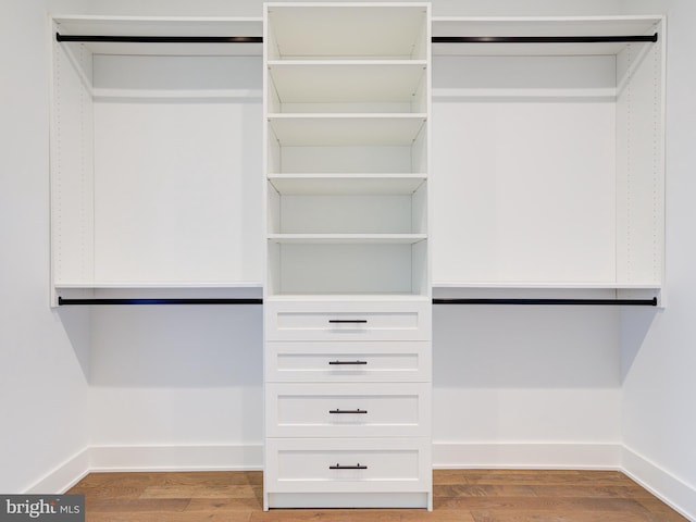 spacious closet featuring light hardwood / wood-style floors