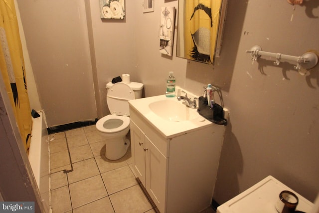 bathroom featuring vanity, toilet, and tile patterned flooring