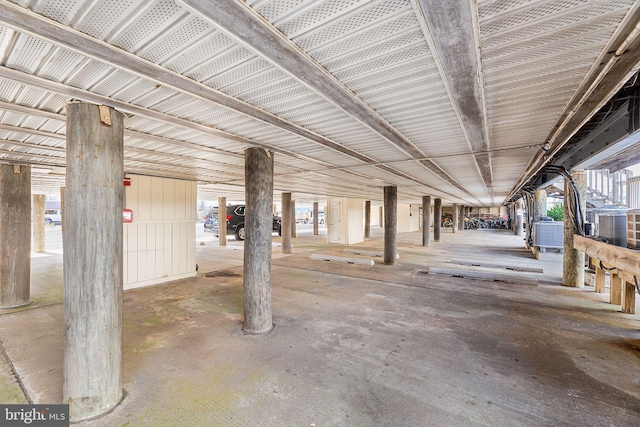 parking deck featuring metal wall and central air condition unit