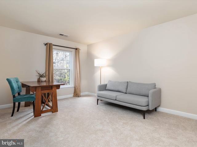 office area featuring light colored carpet