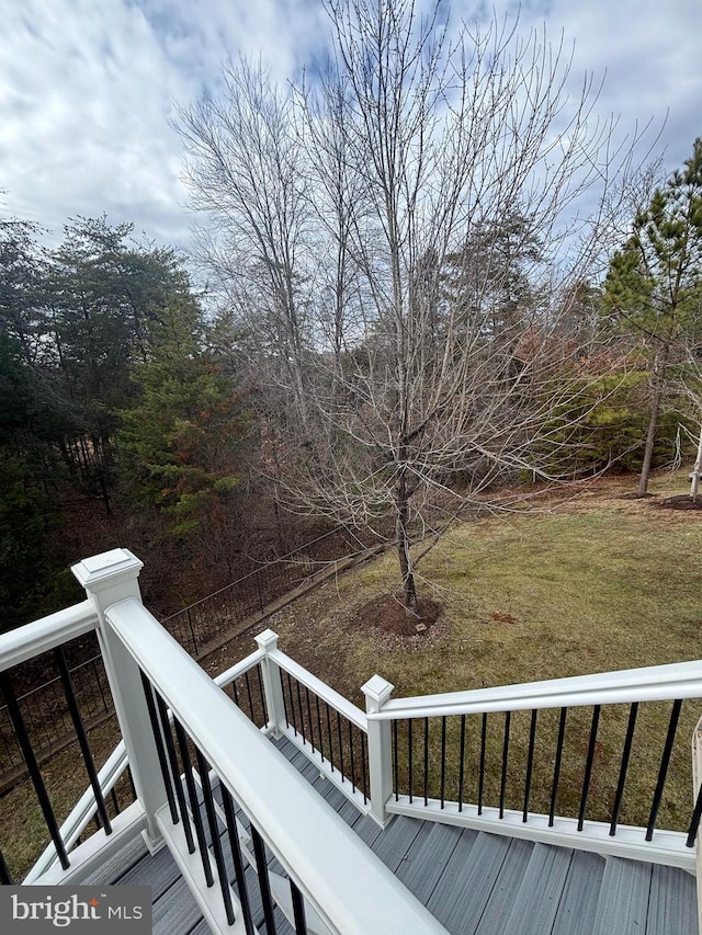 wooden deck with a yard