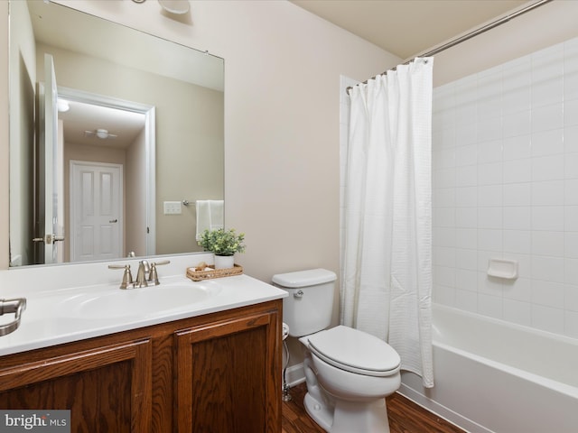 full bathroom with vanity, wood-type flooring, shower / bathtub combination with curtain, and toilet