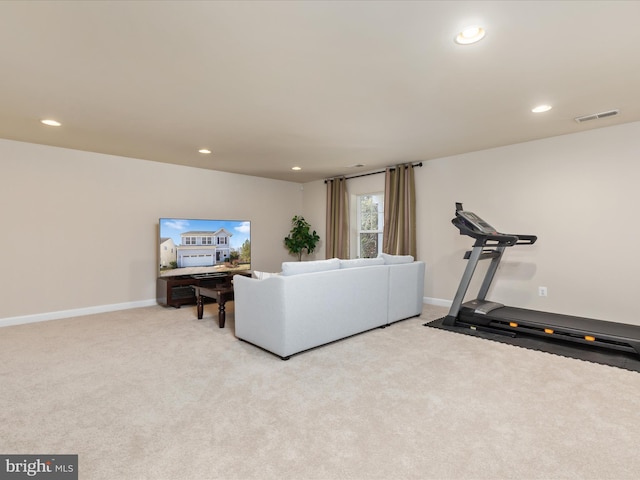 exercise room with light carpet