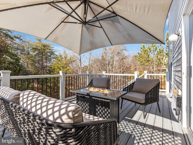 deck featuring a fire pit