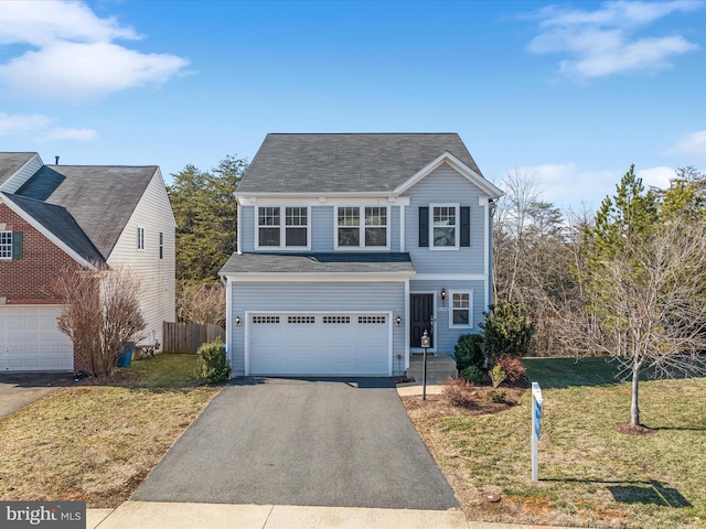 view of front property with a garage and a front lawn