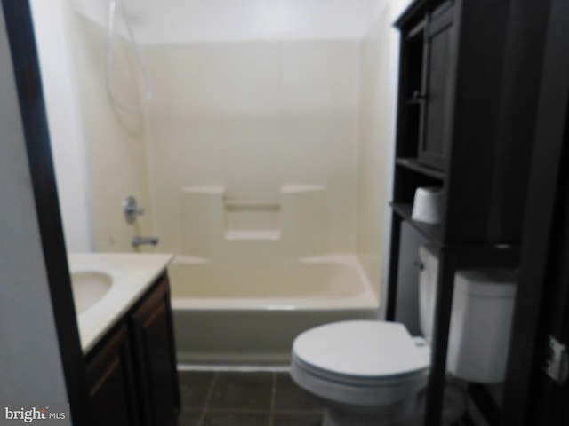 bathroom featuring shower / bath combination, vanity, toilet, and tile patterned floors