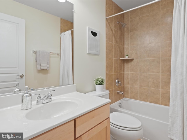 full bathroom with vanity, toilet, and shower / bath combo with shower curtain