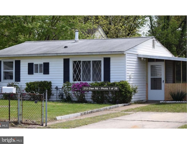 ranch-style house with a front lawn