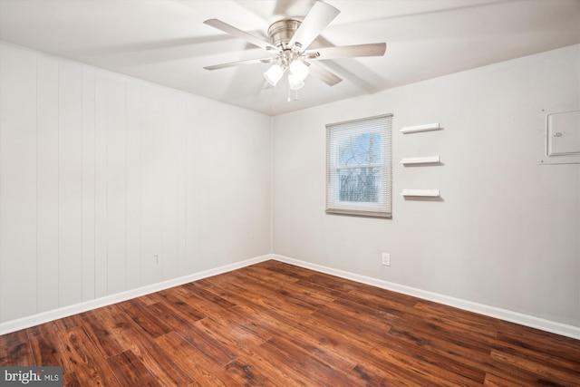 unfurnished room featuring dark wood-type flooring and ceiling fan