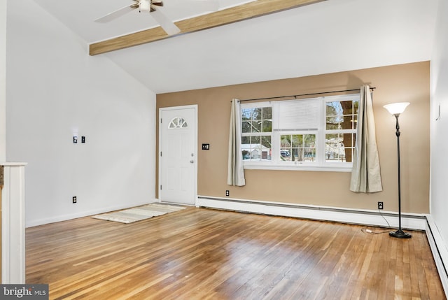 unfurnished living room with wood-type flooring, a baseboard heating unit, vaulted ceiling with beams, and ceiling fan