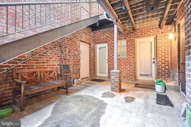 doorway to property with a patio