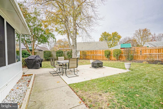 view of yard with a patio area and a fenced backyard