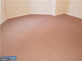 unfurnished room featuring carpet flooring