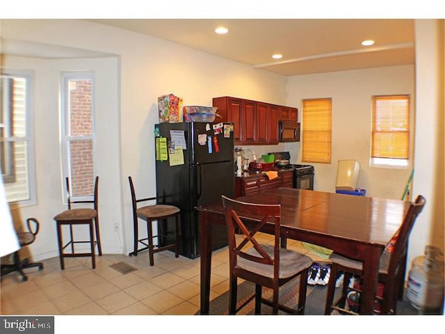 dining space with light tile patterned floors