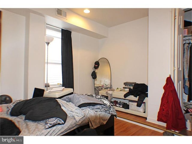 bedroom featuring wood-type flooring