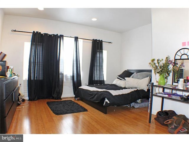 bedroom with wood-type flooring