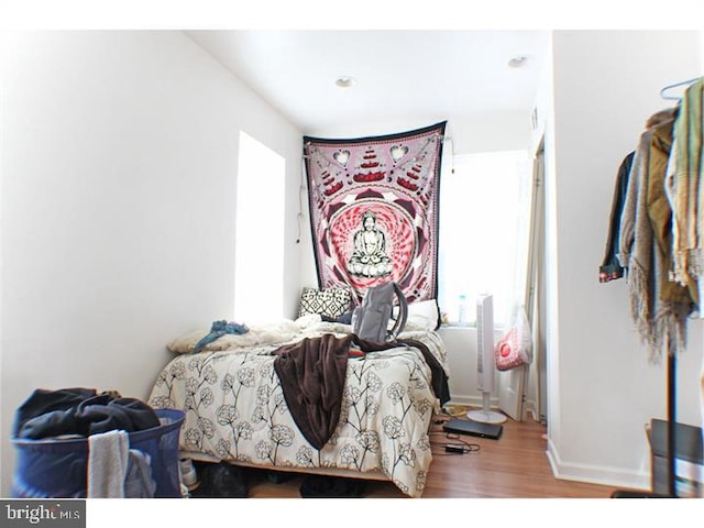 bedroom with light hardwood / wood-style floors