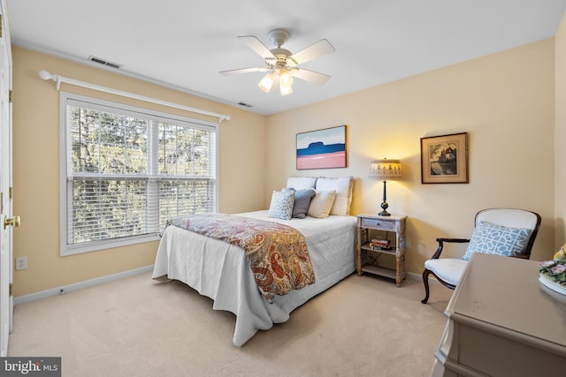 bedroom featuring carpet floors, visible vents, and baseboards