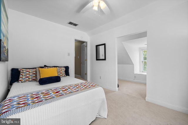 bedroom featuring baseboards, ceiling fan, visible vents, and light colored carpet