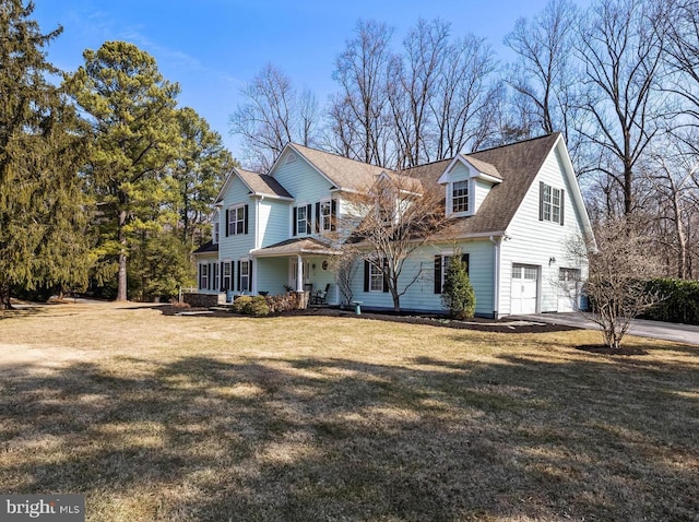 view of front facade featuring an attached garage and a front yard