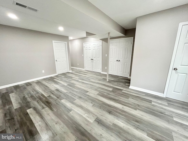 basement featuring hardwood / wood-style flooring