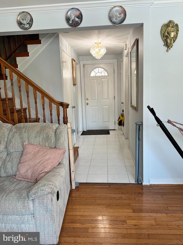 entrance foyer featuring a notable chandelier and light hardwood / wood-style floors