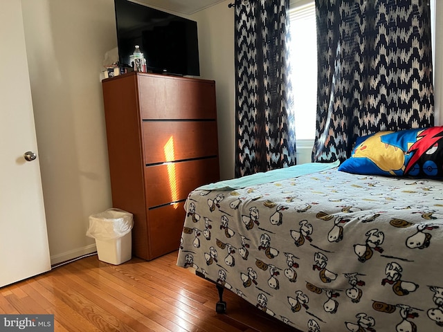 bedroom featuring hardwood / wood-style floors