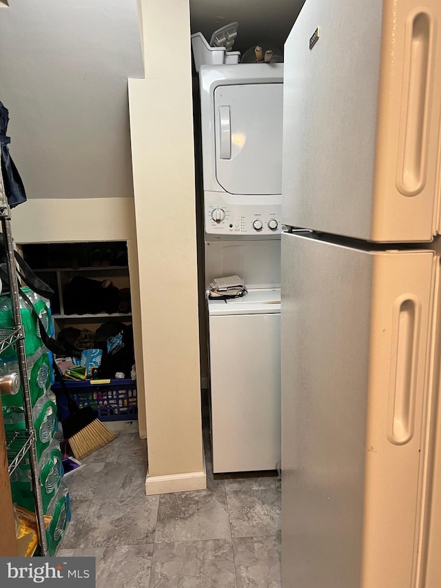 washroom with stacked washer and dryer