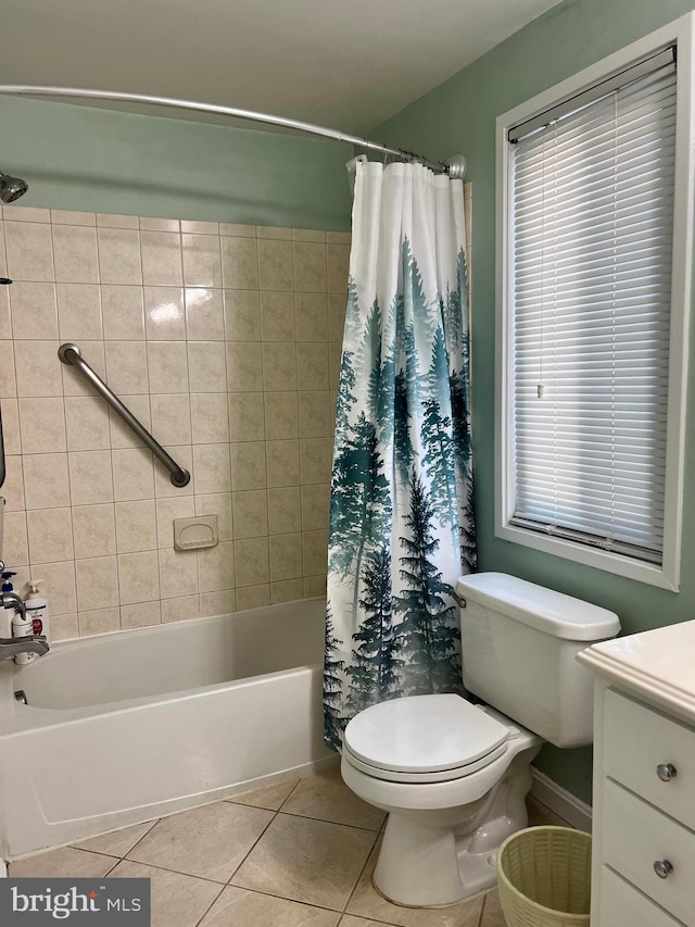 full bathroom with tile patterned flooring, shower / bath combo, vanity, and toilet