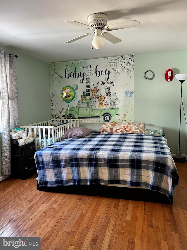 bedroom featuring wood-type flooring and ceiling fan