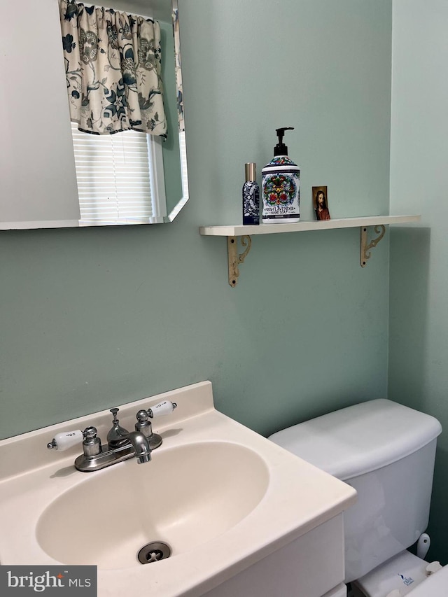 bathroom with sink and toilet