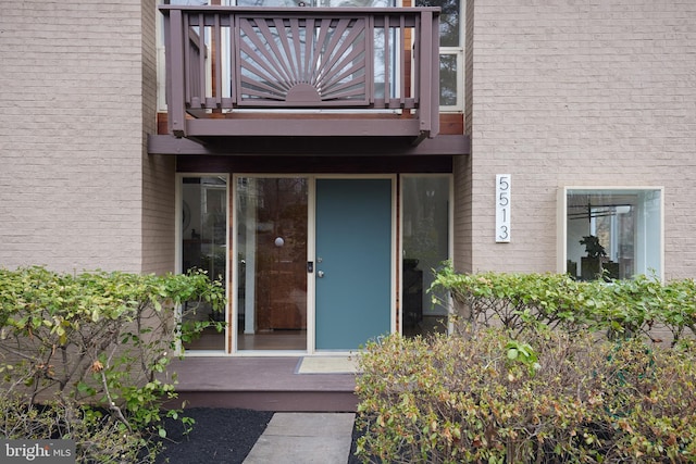 property entrance with a balcony