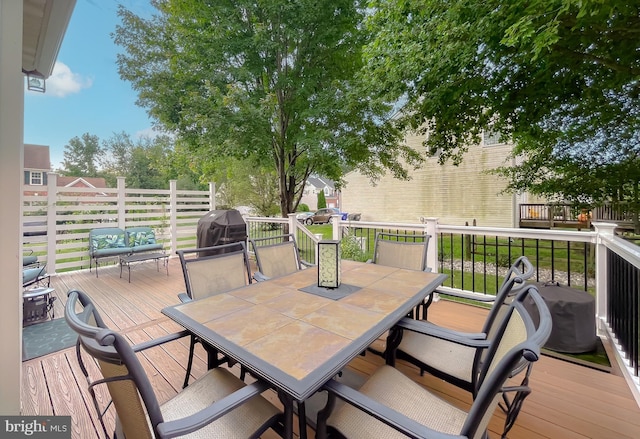 wooden deck with outdoor dining area