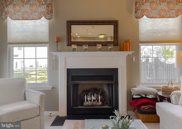 sitting room with a fireplace with flush hearth