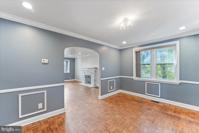 spare room featuring parquet flooring and ornamental molding