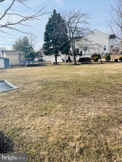 view of yard featuring a trampoline