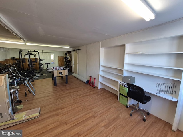 office space with wood-type flooring