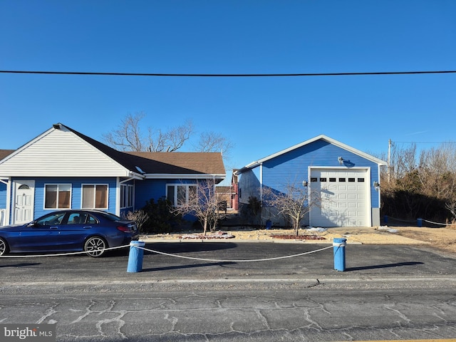 single story home featuring a garage