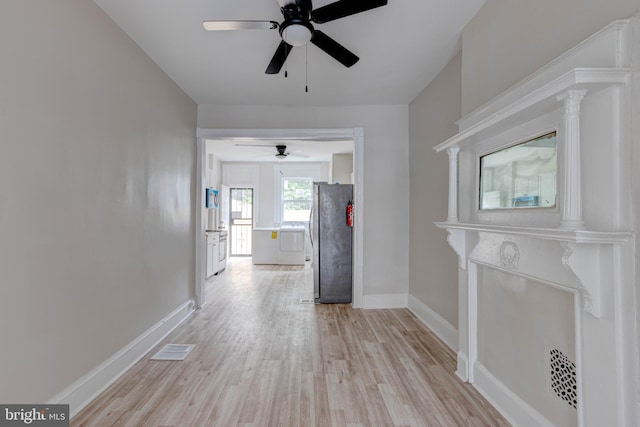 hallway with light wood-type flooring