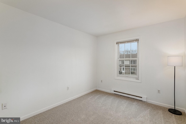 unfurnished room featuring carpet floors and a baseboard radiator