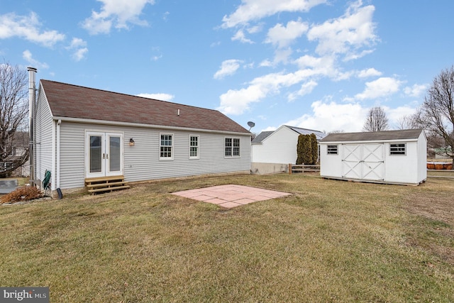 rear view of property with a patio and a lawn