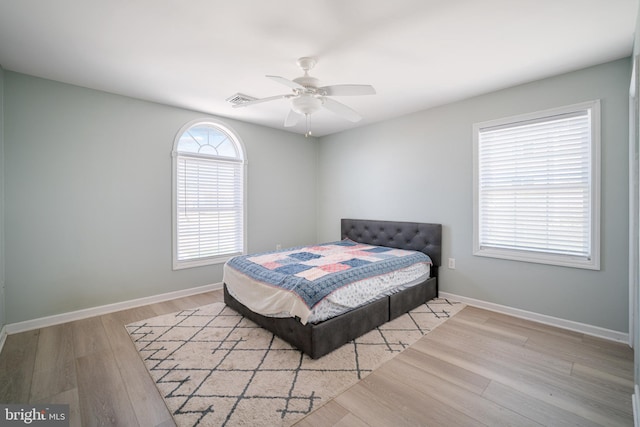 bedroom featuring ceiling fan and light hardwood / wood-style flooring