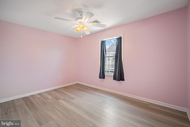 unfurnished room with light hardwood / wood-style floors and ceiling fan