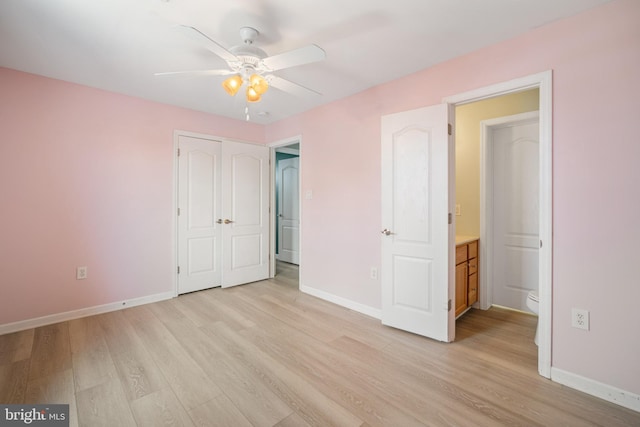 unfurnished bedroom with ceiling fan and light wood-type flooring