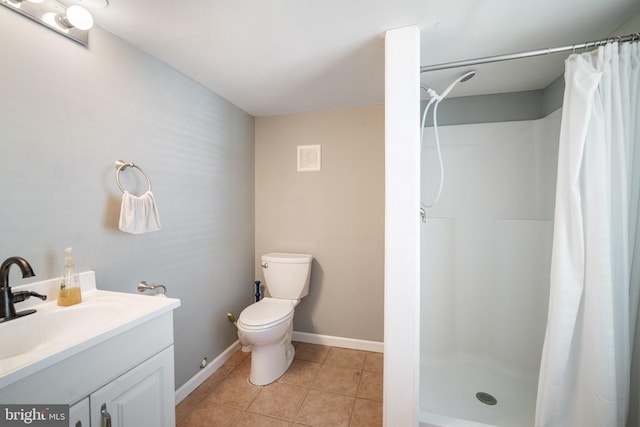 bathroom featuring tile patterned flooring, toilet, vanity, and a shower with curtain