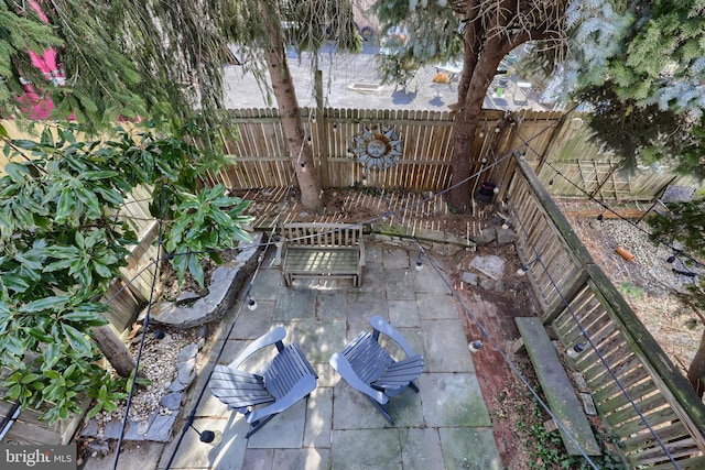 view of patio featuring fence